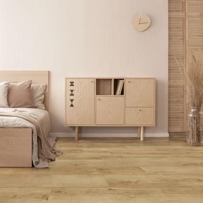 mocha color drenched bedroom with woodlook floors